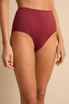 anja bikini high-waisted bikini bottom la magnétique  terracotta close up face