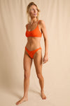 anja bikini bottom bikini tanga le canon  orange plain background